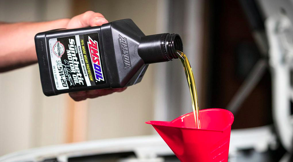 Pouring AMSOIL Signature Series Oil